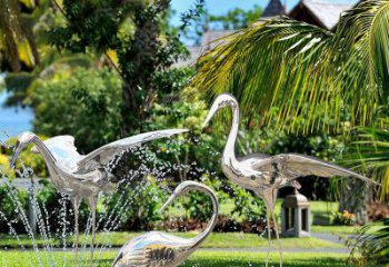 淄博鹤雕塑-公园池塘不锈钢镜面抽象喷泉中的鹤雕塑